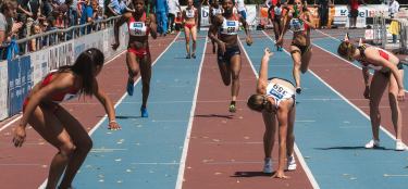 athletes running on track